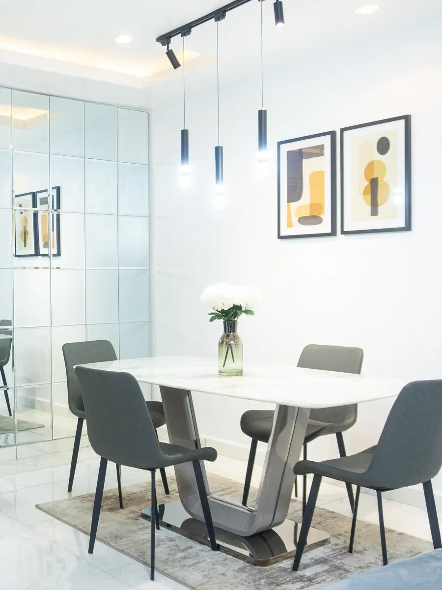 Contemporary dining area with a marble-top table and pendant lights